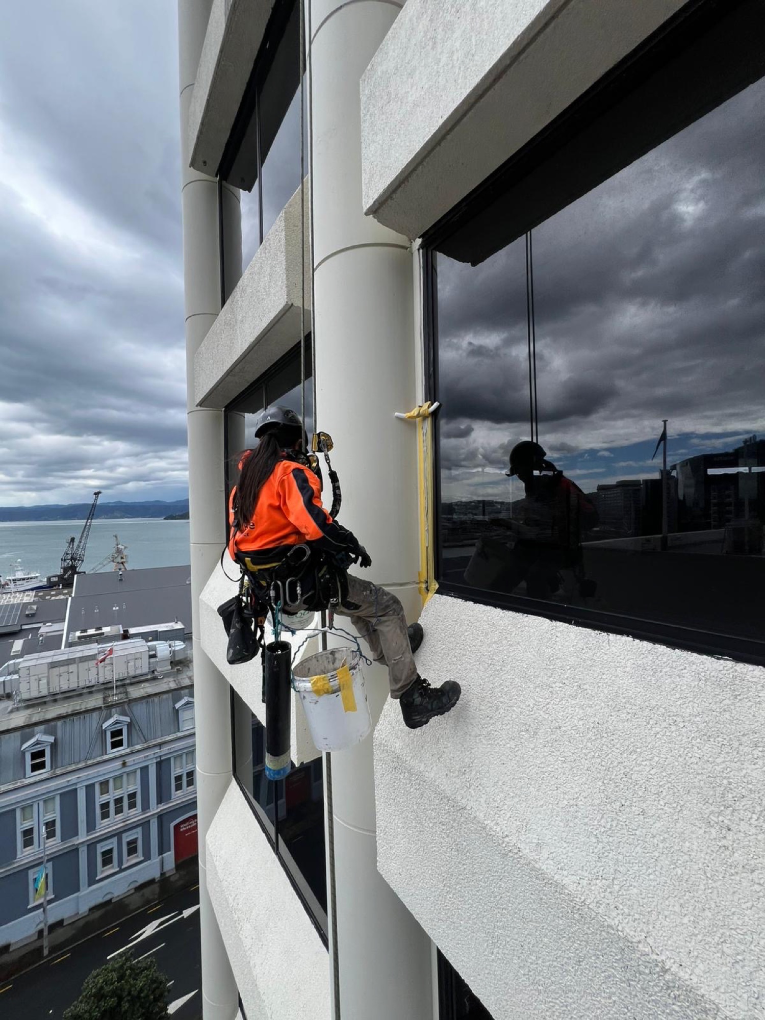 Rope access technician working a CBD building column