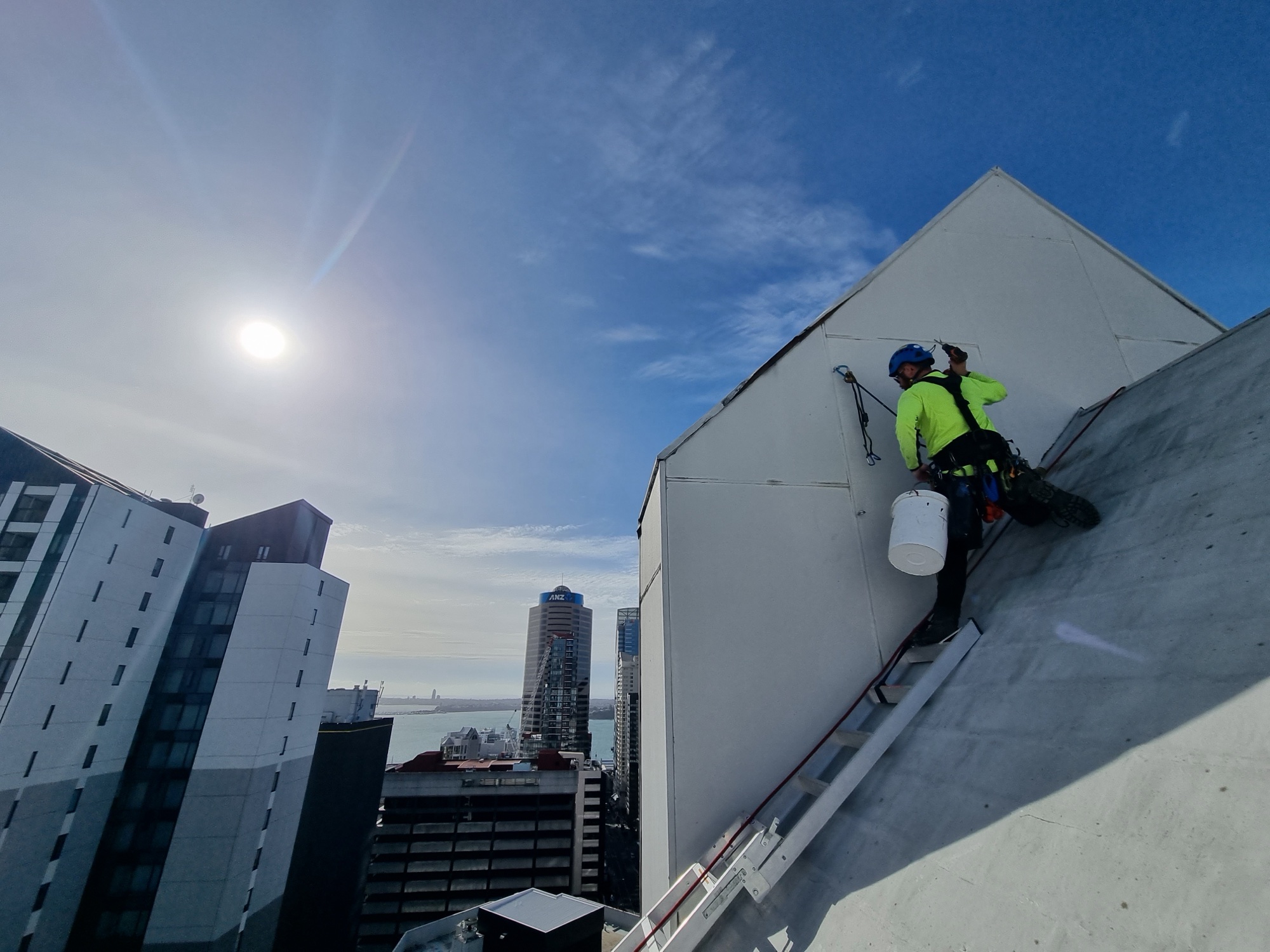 Highrise technician working at height above Wellington CBD