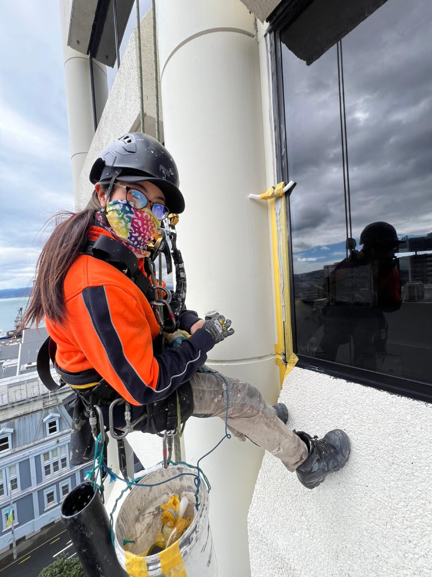 Highrise rope access technician at work